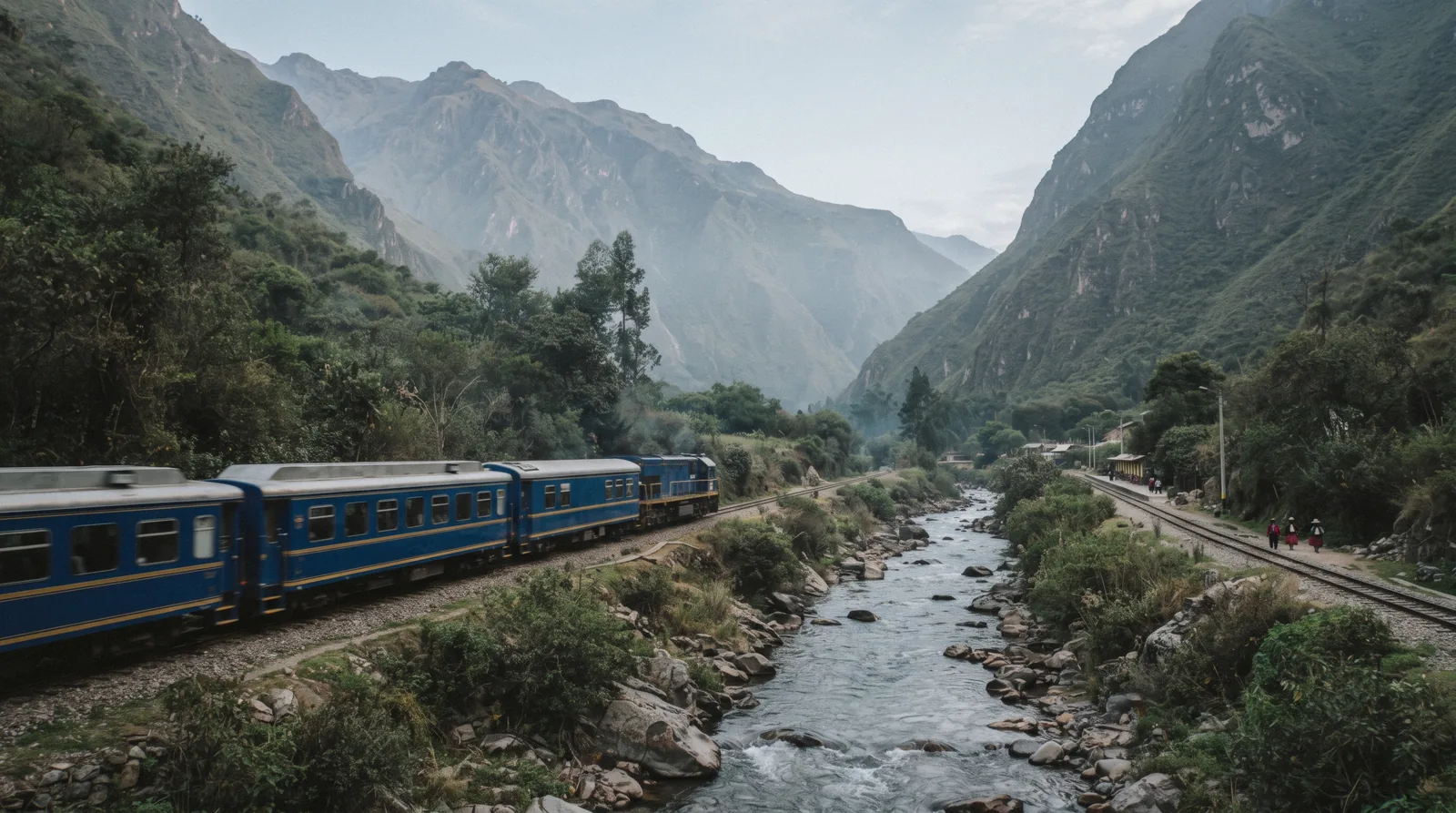 A PeruRail train running through the Urubamba valley toward Machu Picchu, Peru
