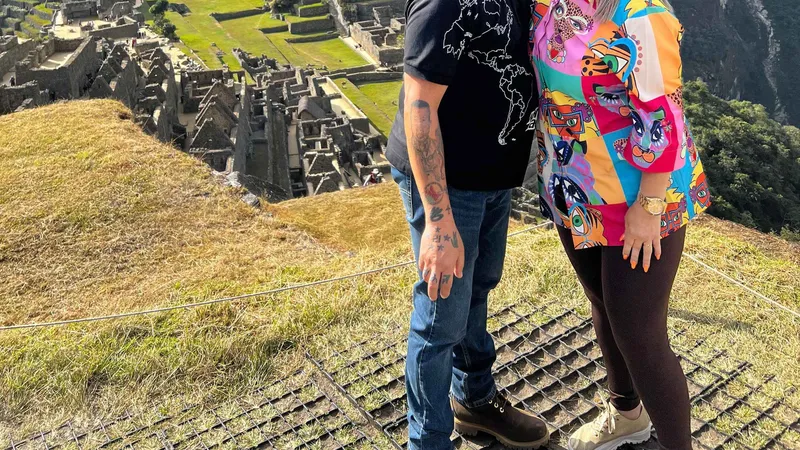 Guide pointing out Inca ruins to a small group on Circuit 1 at Machu Picchu, Peru