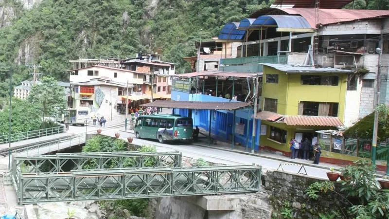 Tourist bus climbing the switchback road from Aguas Calientes to Machu Picchu, Peru