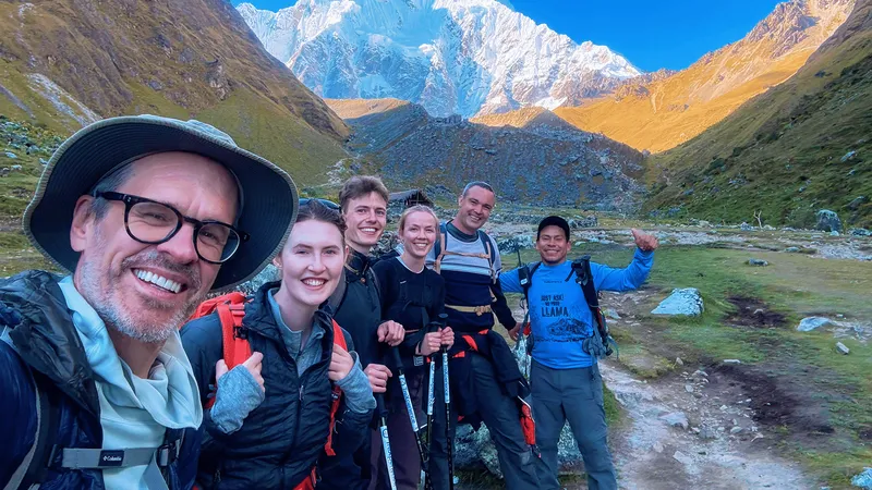 Trekkers at Humantay Lake on the 4-day Salkantay trek route to Machu Picchu, Peru