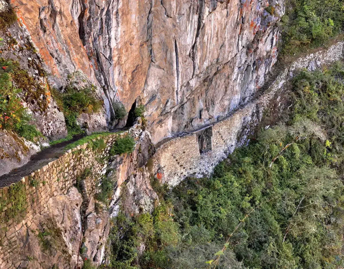 The narrow Inca Bridge path cut into the cliff face near Machu Picchu, Peru