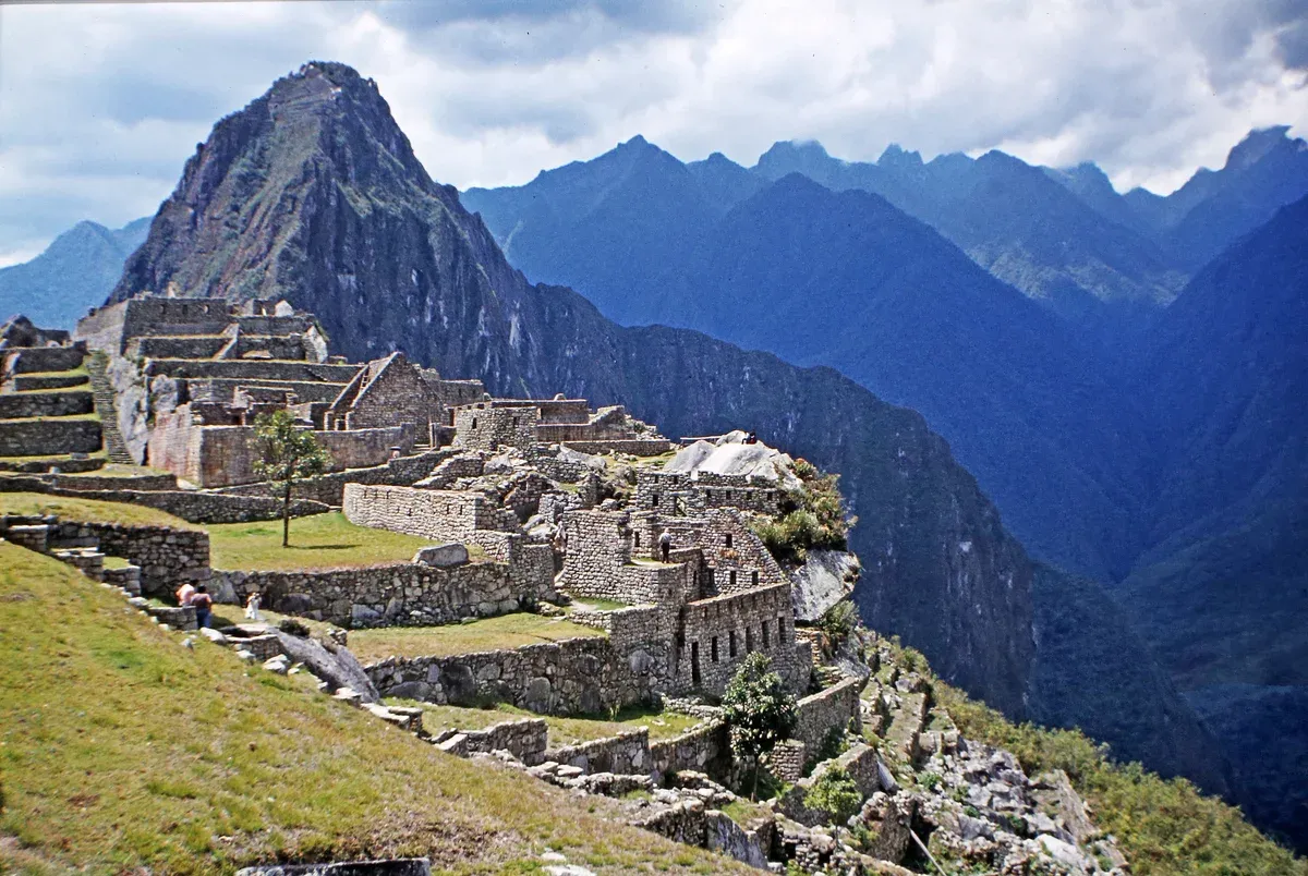 The classic wide view of Machu Picchu citadel with Huayna Picchu peak behind, Aguas Calientes, Peru