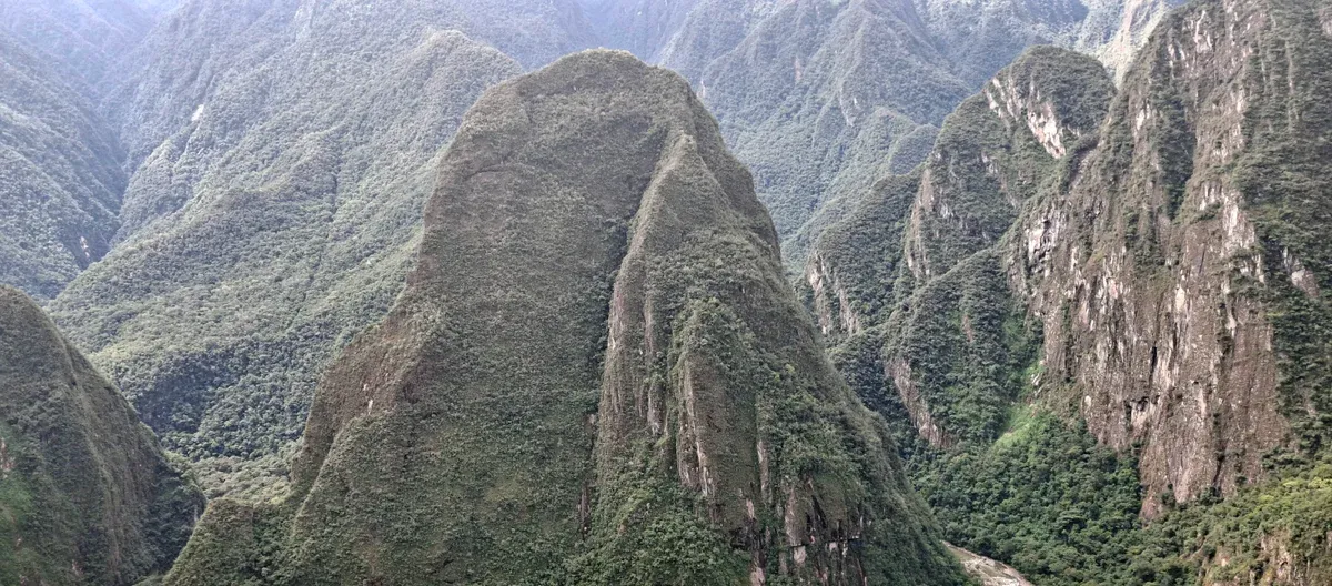 View of Putucusi Mountain's forested slopes from Machu Picchu, Peru
